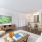 living room with wooden accents, and easy access to the dining room and kitchen