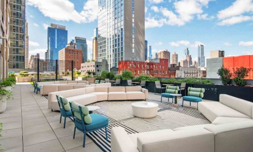 outdoor terrace with ample seating and city skyline views