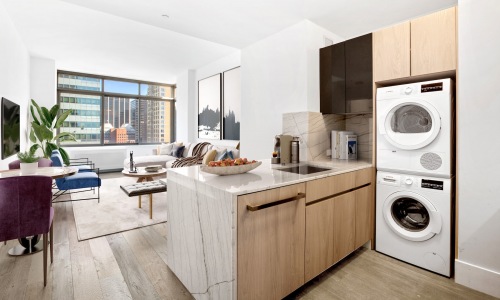 Spacious living rooms with Cobblestone Oak Wood flooring and in-unit Bosch washer & dryers. Cover Image