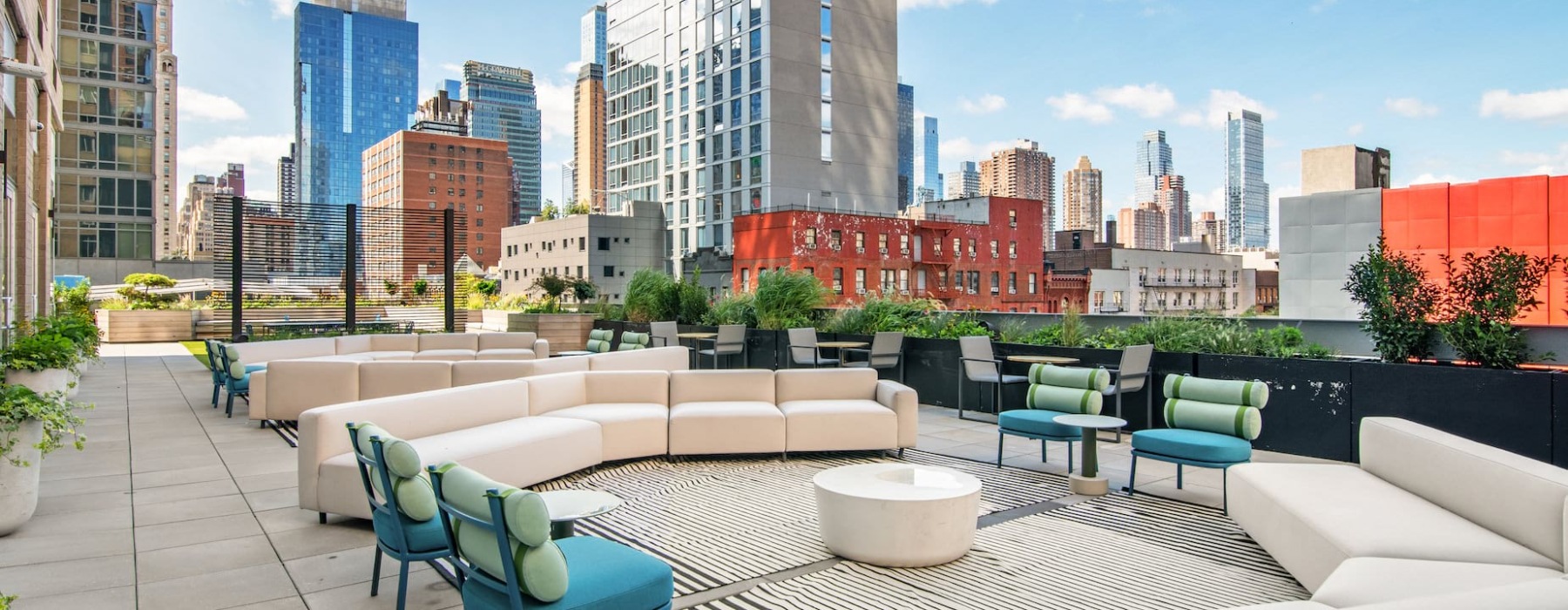 outdoor courtyard with seating and city skyline views