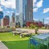 outdoor courtyard with seating and city skyline views