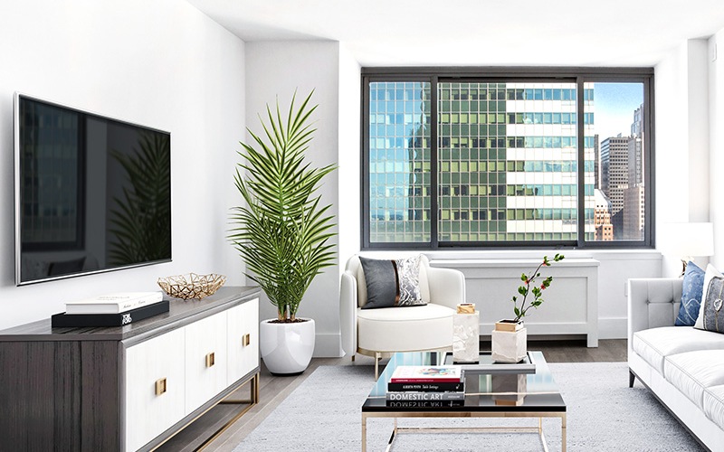 living room with built-in TV, areas for relaxing and window-views of downtown