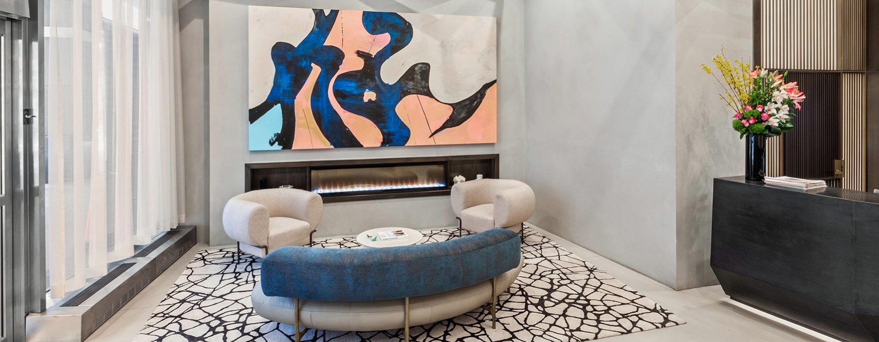 spacious lounge with modern art and seating