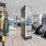 fitness center with equipment and spacious areas on wood-style flooring